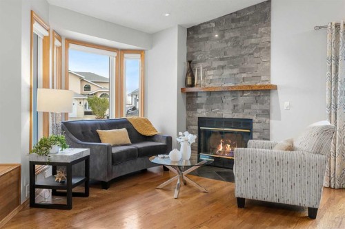 177 Hidden Vale Close Nw, Calgary, AB - Indoor Photo Showing Living Room With Fireplace