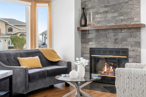 177 Hidden Vale Close Nw, Calgary, AB - Indoor Photo Showing Living Room With Fireplace