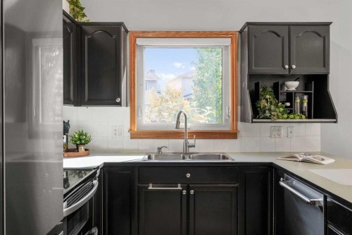 177 Hidden Vale Close Nw, Calgary, AB - Indoor Photo Showing Kitchen With Double Sink