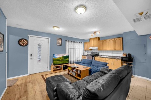 308 Taracove Estate Drive Ne, Calgary, AB - Indoor Photo Showing Living Room