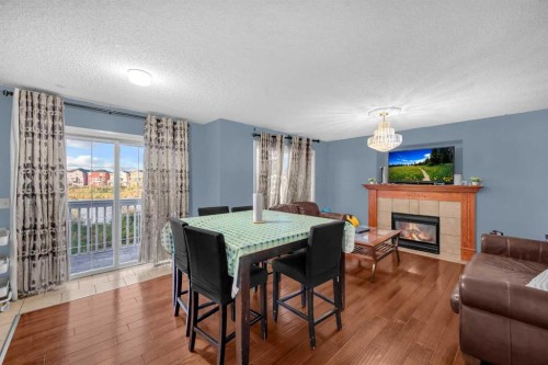 308 Taracove Estate Drive Ne, Calgary, AB - Indoor With Fireplace
