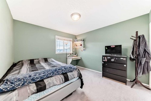 151 Cranwell Close Se, Calgary, AB - Indoor Photo Showing Bedroom