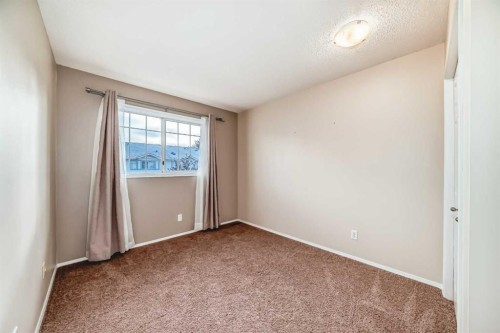 17 Kingsland Court Sw, Calgary, AB - Indoor Photo Showing Other Room