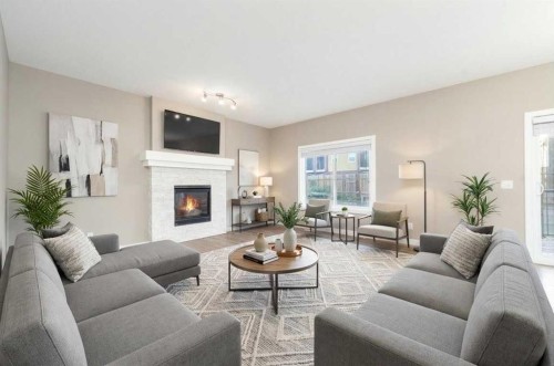 243 Kinniburgh Road, Chestermere, AB - Indoor Photo Showing Living Room With Fireplace