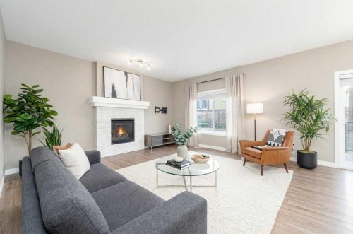243 Kinniburgh Road, Chestermere, AB - Indoor Photo Showing Living Room With Fireplace