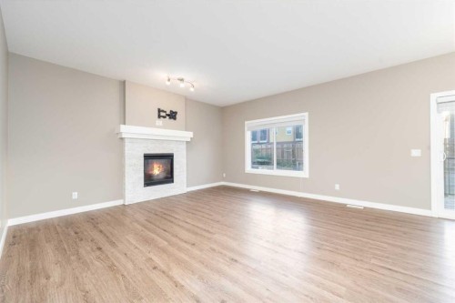 243 Kinniburgh Road, Chestermere, AB - Indoor Photo Showing Living Room With Fireplace