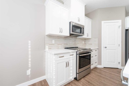 243 Kinniburgh Road, Chestermere, AB - Indoor Photo Showing Kitchen With Upgraded Kitchen