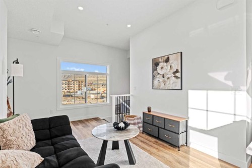112-156 Park Street, Cochrane, AB - Indoor Photo Showing Living Room