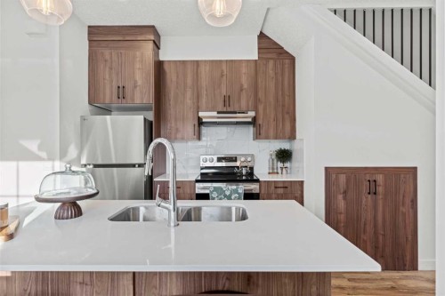 112-156 Park Street, Cochrane, AB - Indoor Photo Showing Kitchen With Double Sink With Upgraded Kitchen