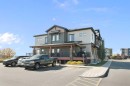 1104-2461 Baysprings Link Sw, Airdrie, AB  - Outdoor With Deck Patio Veranda With Facade 