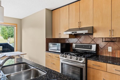 120 Simcoe Close Sw, Calgary, AB - Indoor Photo Showing Kitchen With Double Sink