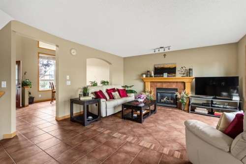 120 Simcoe Close Sw, Calgary, AB - Indoor Photo Showing Living Room With Fireplace