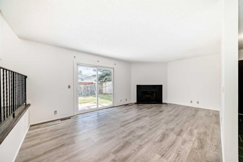 279 Beddington Circle Ne, Calgary, AB - Indoor Photo Showing Living Room With Fireplace
