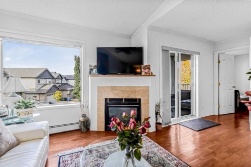 308-3308 Valleyview Park Se, Calgary, AB - Indoor Photo Showing Living Room With Fireplace