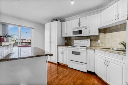 308-3308 Valleyview Park Se, Calgary, AB - Indoor Photo Showing Kitchen With Double Sink