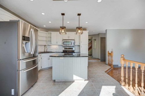 107 Wood Valley Drive Sw, Calgary, AB - Indoor Photo Showing Kitchen With Upgraded Kitchen