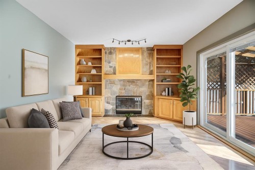 107 Wood Valley Drive Sw, Calgary, AB - Indoor Photo Showing Living Room With Fireplace