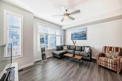 8-138 Seton Passage Se, Calgary, AB - Indoor Photo Showing Living Room