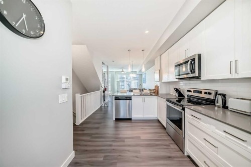 8-138 Seton Passage Se, Calgary, AB - Indoor Photo Showing Kitchen With Stainless Steel Kitchen With Upgraded Kitchen
