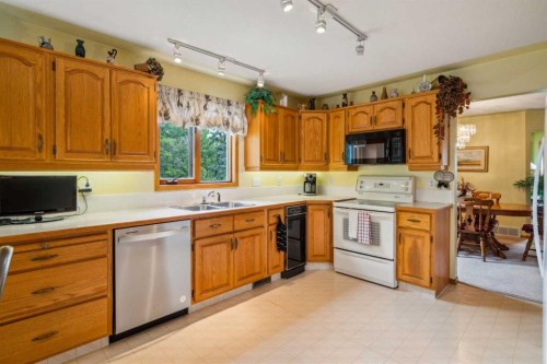 2506 19 Street, Nanton, AB - Indoor Photo Showing Kitchen With Double Sink