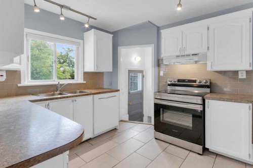 2412 22 Street Nw, Calgary, AB - Indoor Photo Showing Kitchen With Double Sink