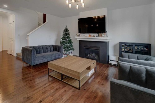 20 Nolancrest Green Nw, Calgary, AB - Indoor Photo Showing Living Room With Fireplace
