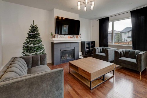 20 Nolancrest Green Nw, Calgary, AB - Indoor Photo Showing Living Room With Fireplace