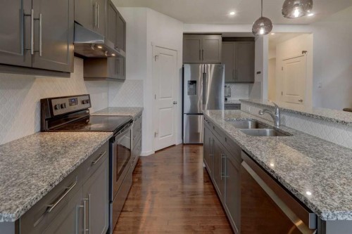 20 Nolancrest Green Nw, Calgary, AB - Indoor Photo Showing Kitchen With Double Sink With Upgraded Kitchen