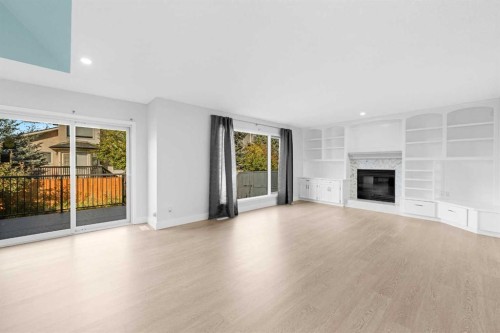 30 Hidden Circle Nw, Calgary, AB - Indoor Photo Showing Living Room With Fireplace