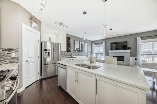 288 Rainbow Falls Green, Chestermere, AB - Indoor Photo Showing Kitchen With Stainless Steel Kitchen With Double Sink With Upgraded Kitchen