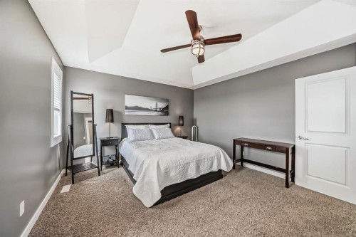 288 Rainbow Falls Green, Chestermere, AB - Indoor Photo Showing Bedroom