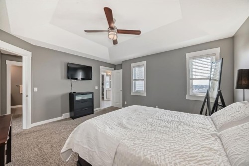 288 Rainbow Falls Green, Chestermere, AB - Indoor Photo Showing Bedroom