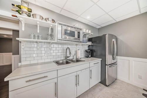 288 Rainbow Falls Green, Chestermere, AB - Indoor Photo Showing Kitchen With Double Sink