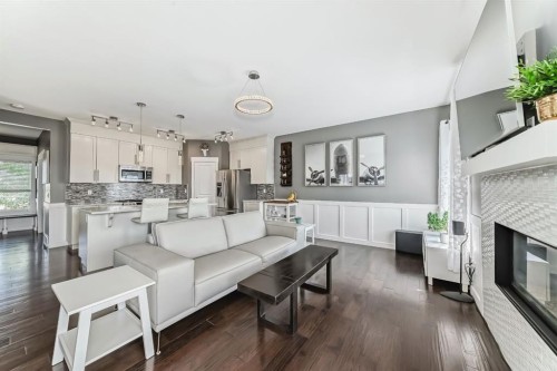 288 Rainbow Falls Green, Chestermere, AB - Indoor Photo Showing Living Room With Fireplace