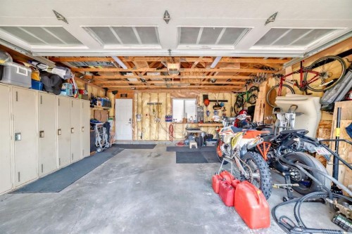 288 Rainbow Falls Green, Chestermere, AB - Indoor Photo Showing Garage