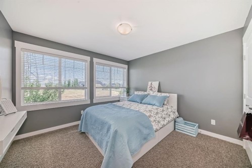 288 Rainbow Falls Green, Chestermere, AB - Indoor Photo Showing Bedroom