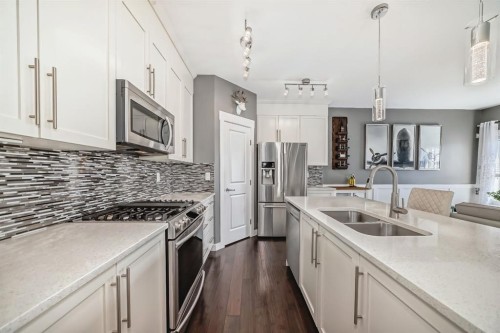 288 Rainbow Falls Green, Chestermere, AB - Indoor Photo Showing Kitchen With Stainless Steel Kitchen With Double Sink With Upgraded Kitchen