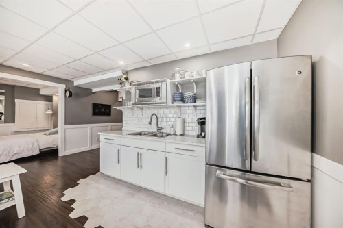 288 Rainbow Falls Green, Chestermere, AB - Indoor Photo Showing Kitchen With Double Sink