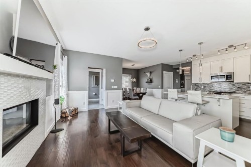 288 Rainbow Falls Green, Chestermere, AB - Indoor Photo Showing Living Room With Fireplace