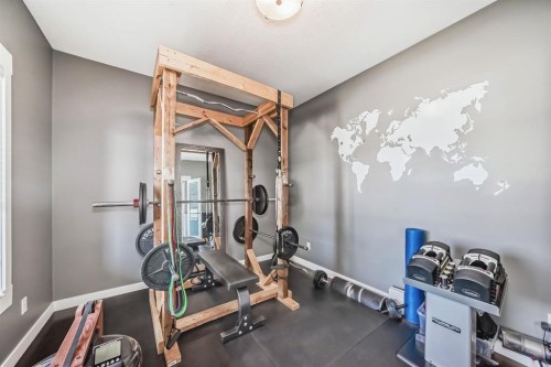 288 Rainbow Falls Green, Chestermere, AB - Indoor Photo Showing Gym Room