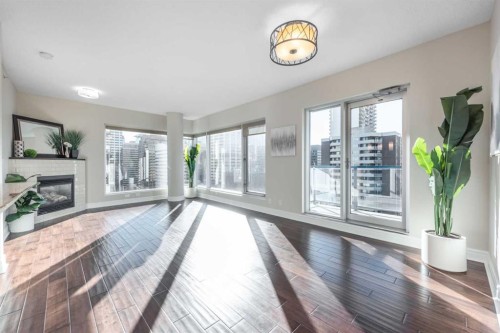 1807-920 5 Avenue Sw, Calgary, AB - Indoor With Fireplace