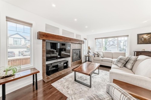 182 Sunset Heights, Cochrane, AB - Indoor Photo Showing Living Room With Fireplace