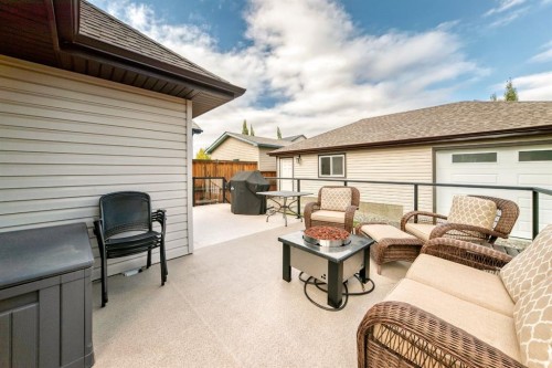 182 Sunset Heights, Cochrane, AB - Outdoor With Deck Patio Veranda With Exterior