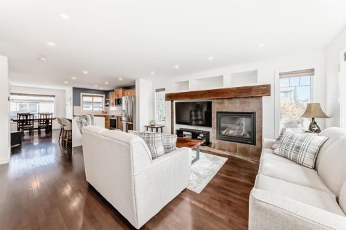 182 Sunset Heights, Cochrane, AB - Indoor Photo Showing Living Room With Fireplace
