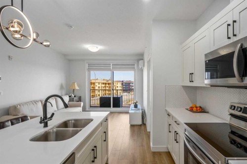 2406-200 Seton Circle Se, Calgary, AB - Indoor Photo Showing Kitchen With Double Sink