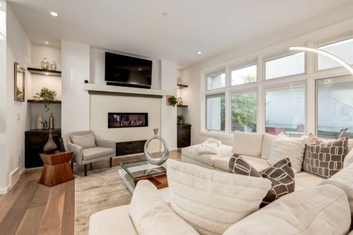 134 6 Avenue Nw, Calgary, AB - Indoor Photo Showing Living Room With Fireplace