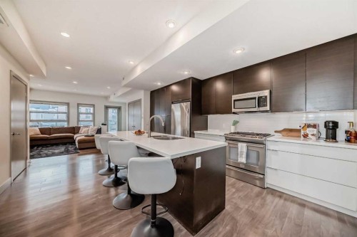 204-1707 27 Avenue Sw, Calgary, AB - Indoor Photo Showing Kitchen With Stainless Steel Kitchen With Upgraded Kitchen