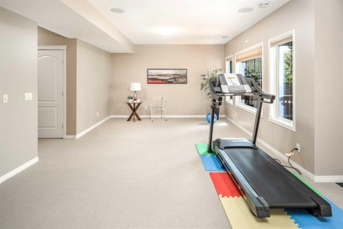 105 Aspen Stone Road Sw, Calgary, AB - Indoor Photo Showing Gym Room
