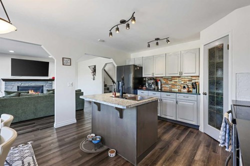 52 West Edge Road, Cochrane, AB - Indoor Photo Showing Kitchen With Upgraded Kitchen