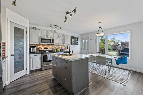 52 West Edge Road, Cochrane, AB - Indoor Photo Showing Kitchen With Stainless Steel Kitchen With Double Sink